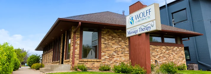 Clinic surrounded by greenery under a bright blue sky